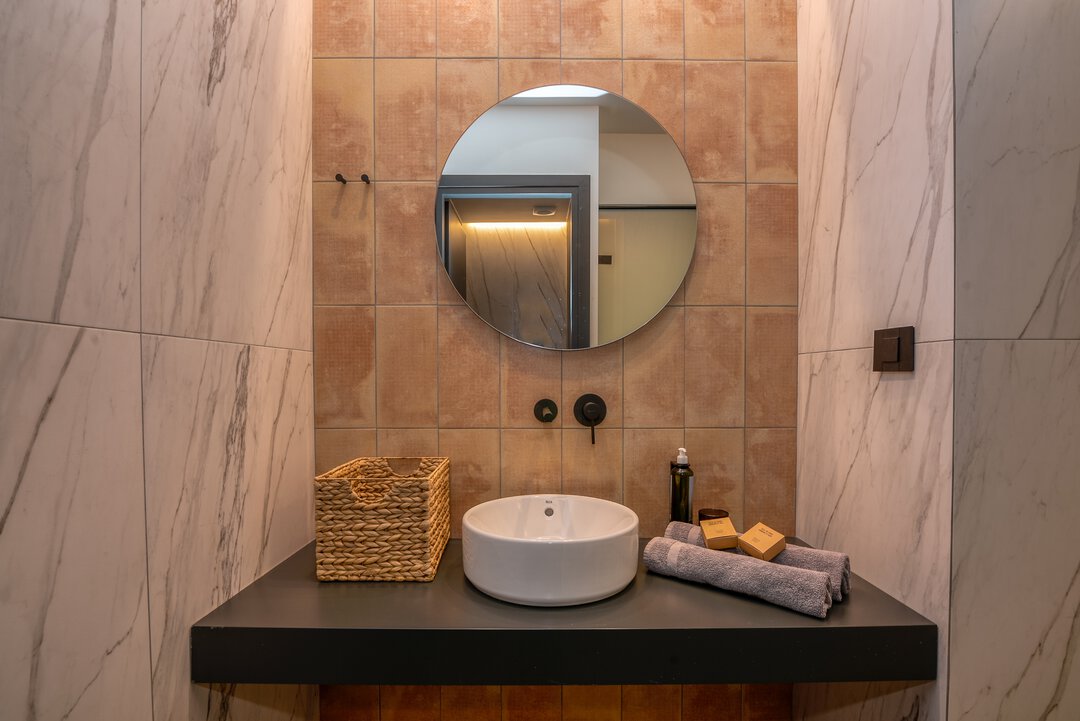 Inviting bedroom with plush pillows, quality linens, and peaceful ambiance at Nusa Gramvousa villa, Crete