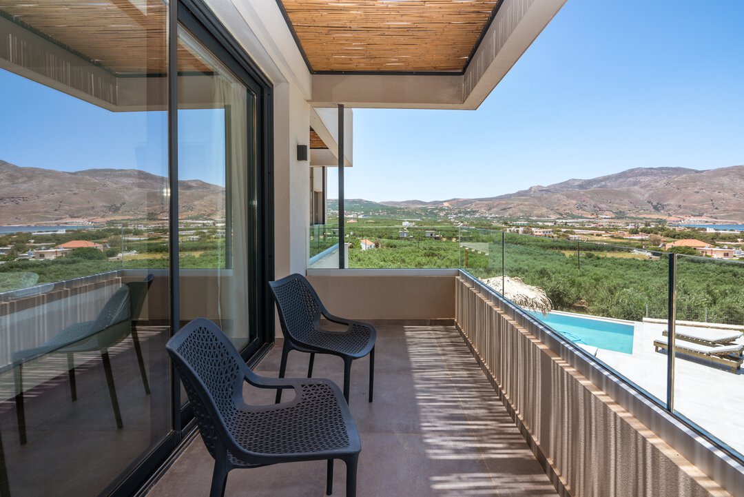 Bathroom vanity area with round mirror, vessel sink, and stylish accessories at Nusa Gramvousa, Crete
