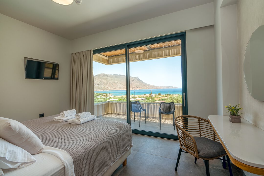 Elegant bathroom with marble walls, floating vanity, and recessed lighting at Nusa Gramvousa villa, Crete
