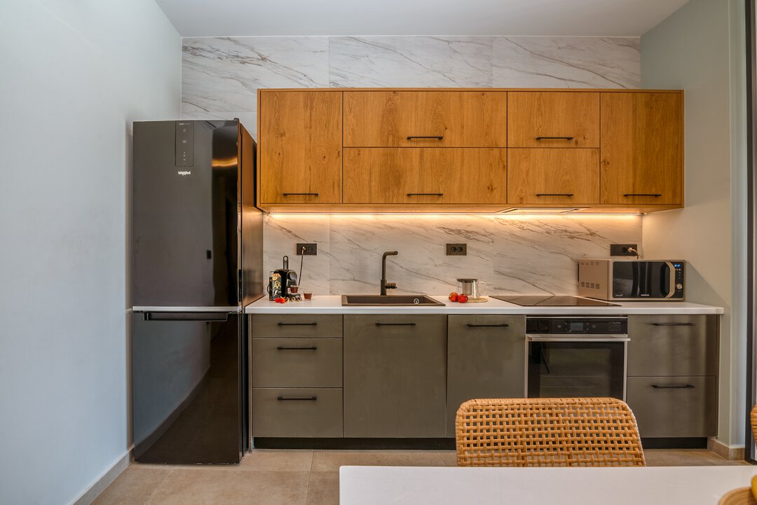 Kitchen counter with built-in oven, microwave, and coffee facilities at Nusa Gramvousa, Crete