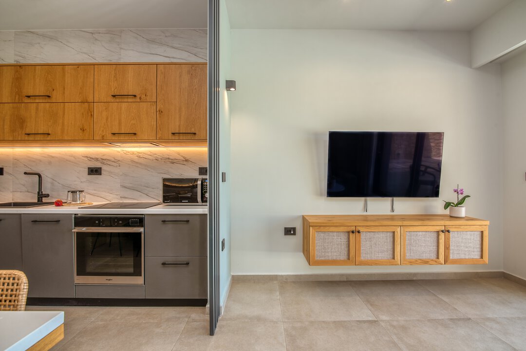 Comfortable living area with modern furniture, natural light, and connection to outdoor spaces at Nusa Gramvousa, Crete