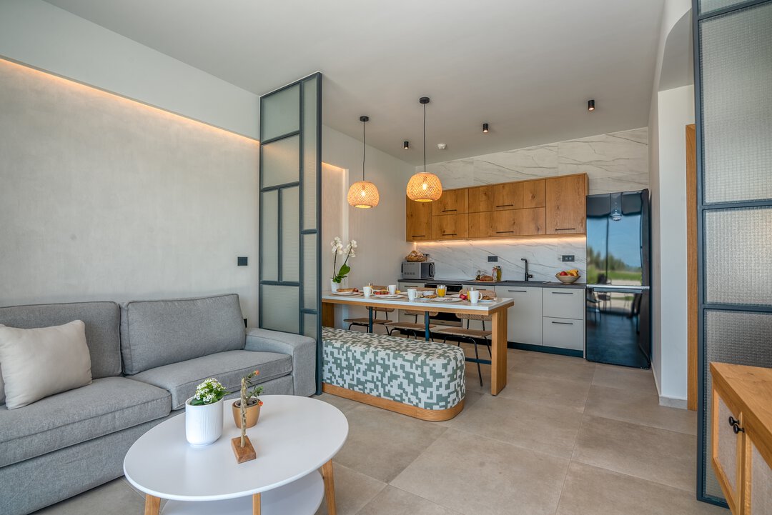 Contemporary toilet area with wall-hung WC and quality finishes at Nusa Falassarna villa, Crete
