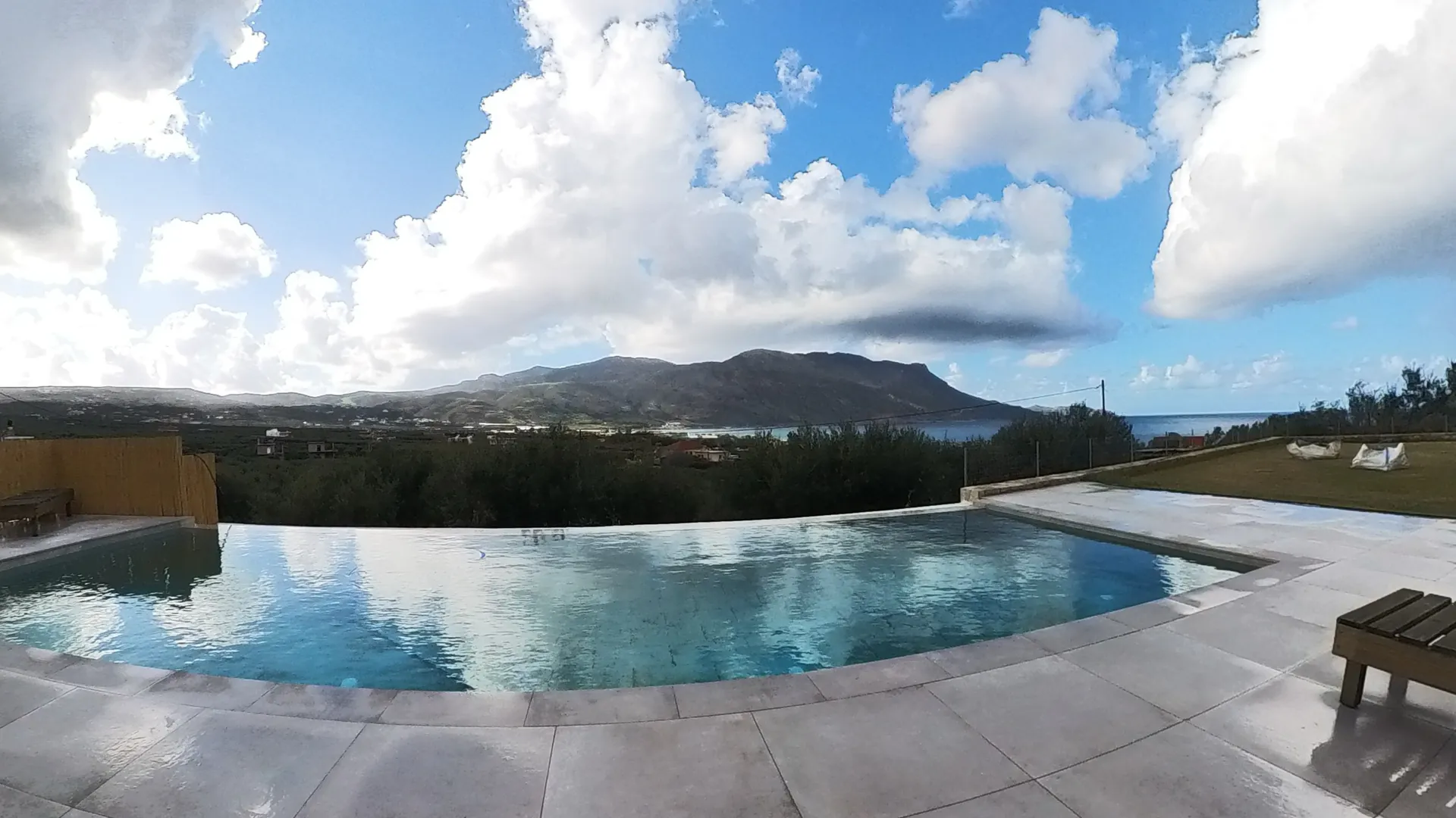 NUSA Falasarna infinity-pool villa interior and terrace details