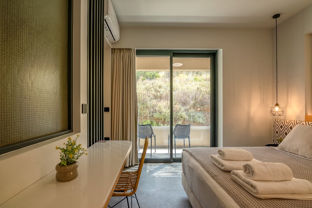 Elegant guest bedroom with neutral palette at Nusa Balos villa near Balos Lagoon, Crete