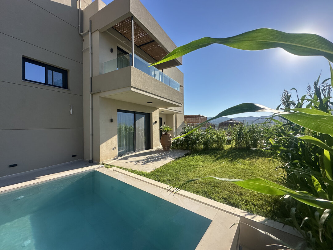NUSA Balos outdoor terraces, pool, and pergola spaces
